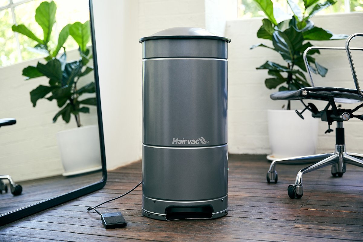Hairvac salon vacuum in use in a working salon